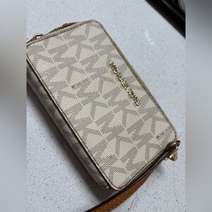 Michael Kors wallet on a strap crossbody